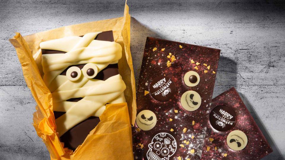 Chocolate bars with eyes and Halloween decorations