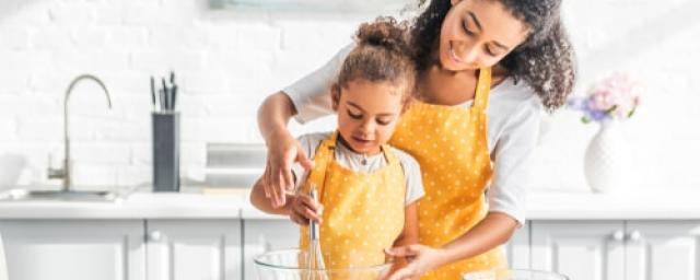 woman baking with child