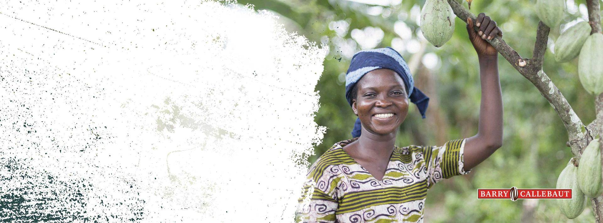 Woman with sustainably grown cocoa tree