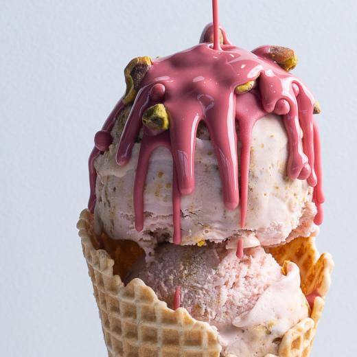 pink ice cream cone on gray background