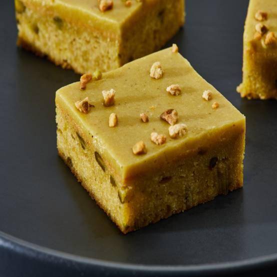 pistachio white chocolate brownie on black plate