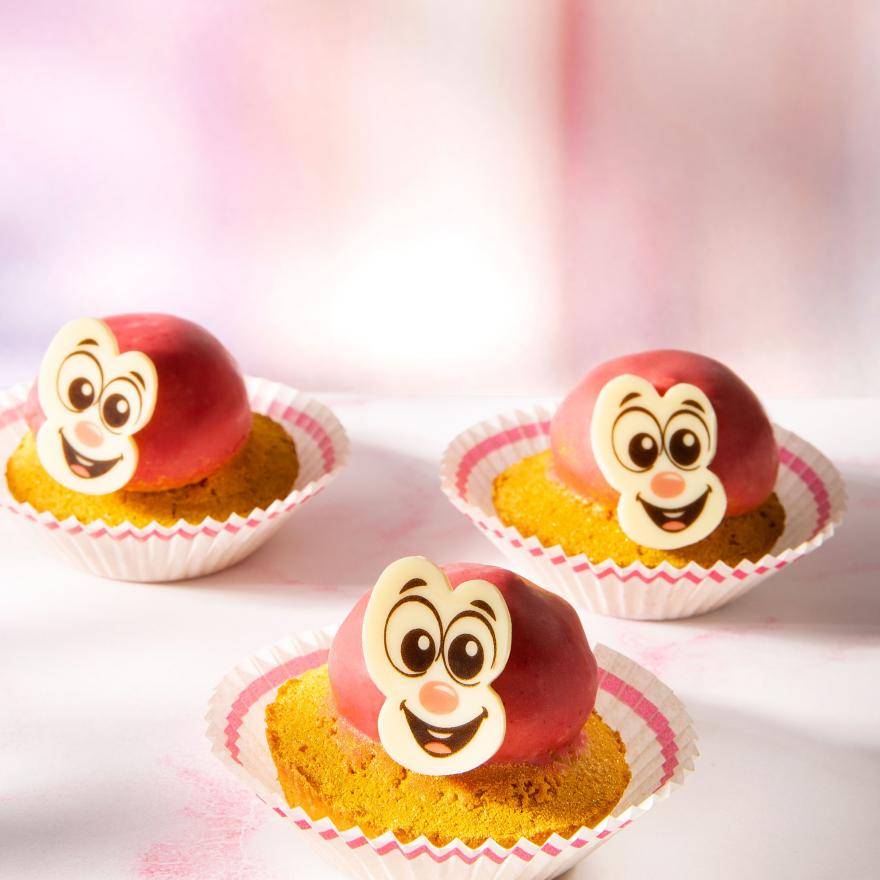 Cupcakes with happy face chocolate decorations