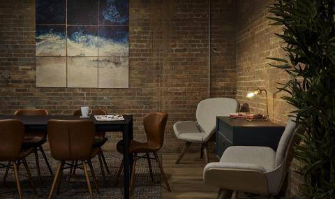 the office's cozy brick-walled library space
