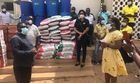 Charity Sackiety, Managing Director Ghana, presenting food donations to support 500 families in the surrounding Tema area, Ghana
