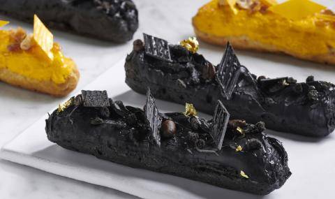Black themed éclairs with decorations