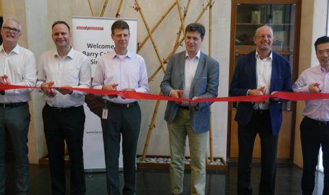 Cutting the ribbon at new chocolate manufacturing facility in Singapore