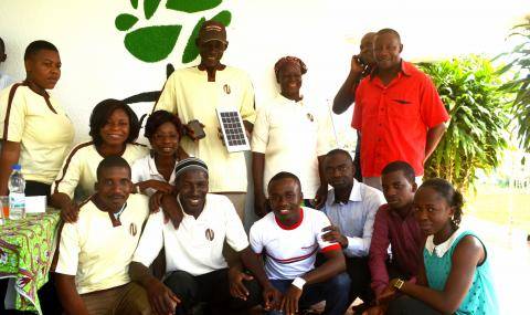 The Biopartenaire team celebrating the 10,000th mobile banking participant Zallé Alimissi Salame