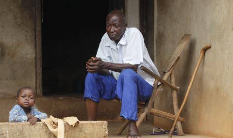 Cocoa farmer community - father with child