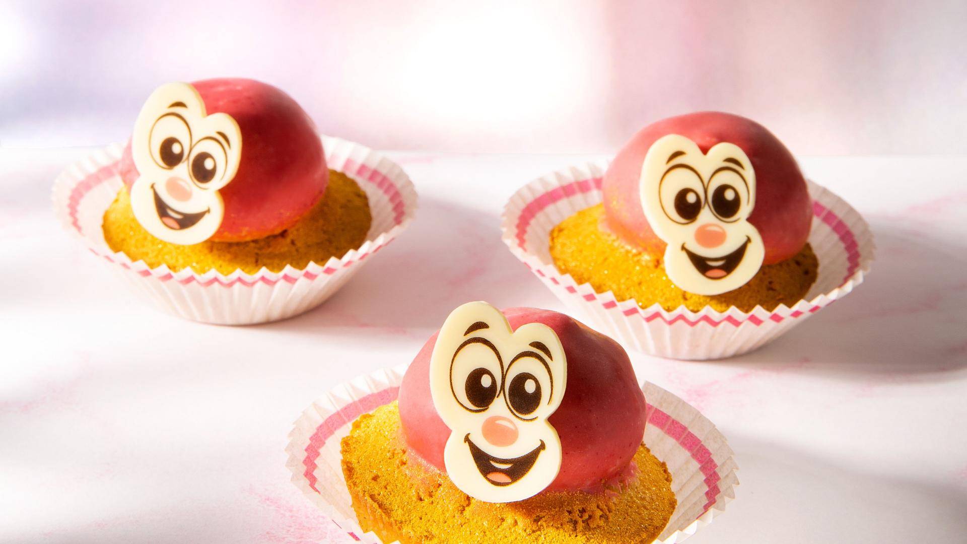 Cupcakes with happy face chocolate decorations