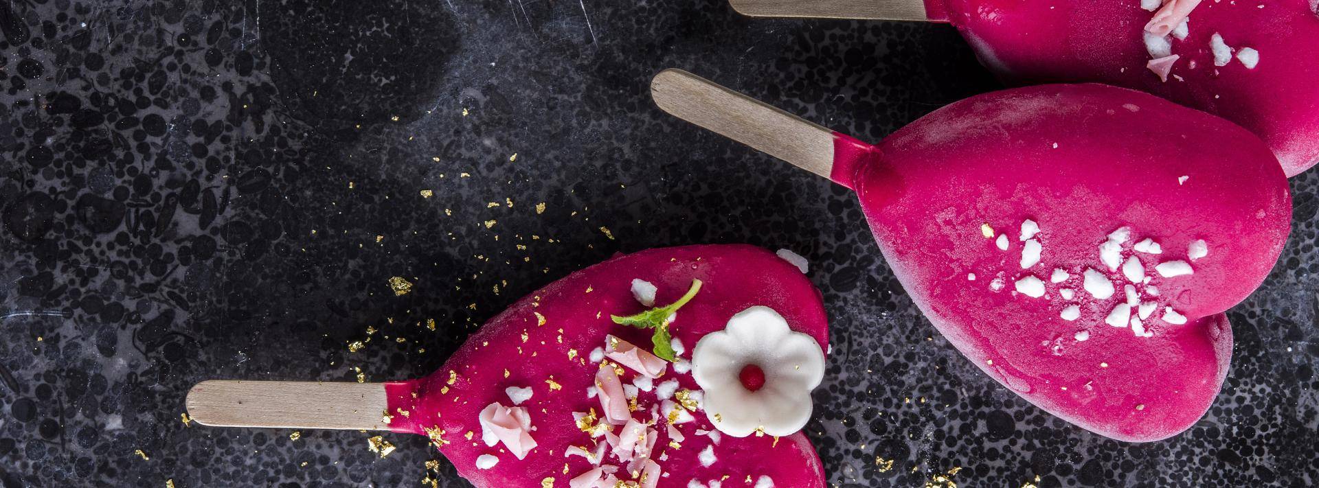 Pink ice cream sticks with Ruby chocolate curls and other decorations