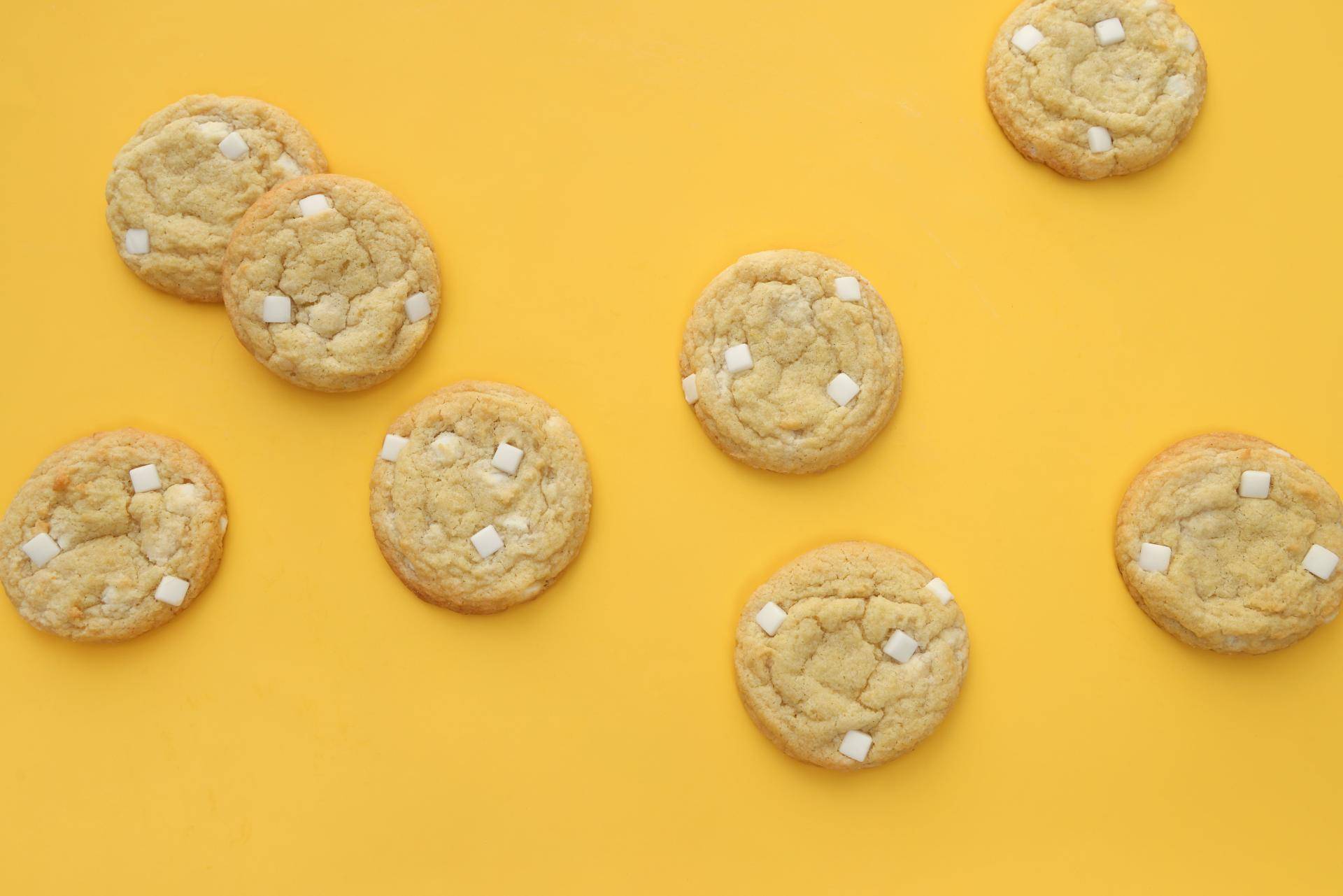yellow background with cookies on it