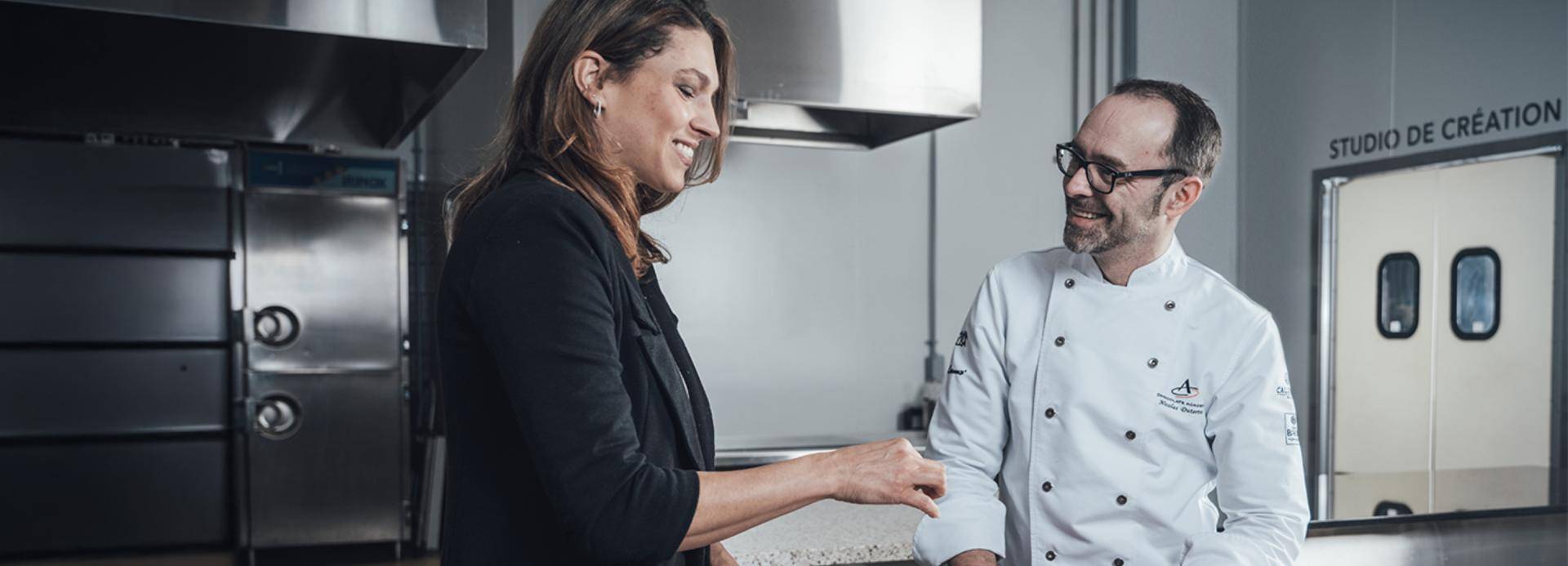 chef in kitchen with customer