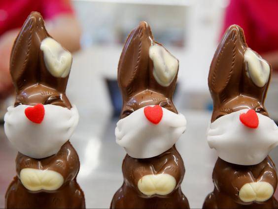 Chocolate Easter bunnies wearing protective masks are seen at Baeckerei Bohnenblust bakery in Bern, Switzerland