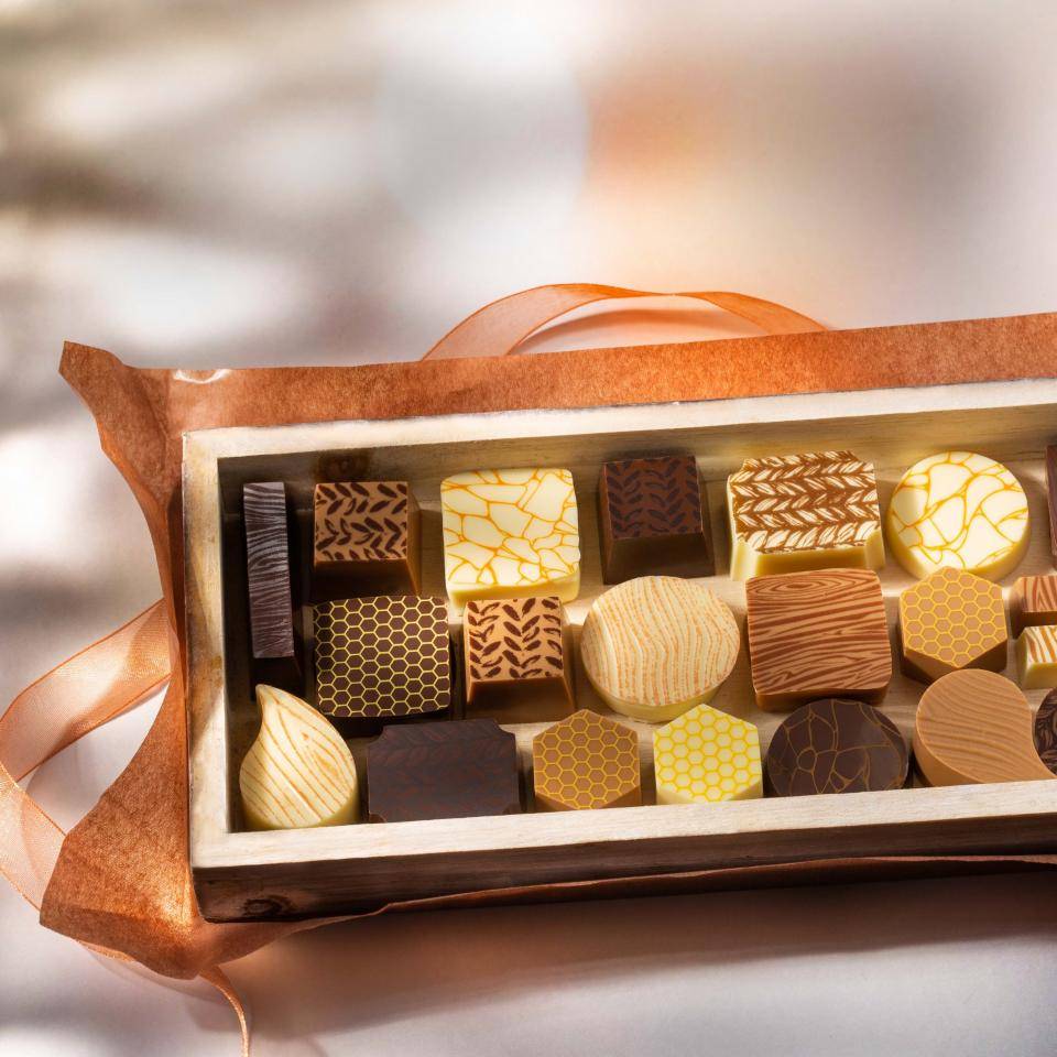 Box of pralines with various prints and texture