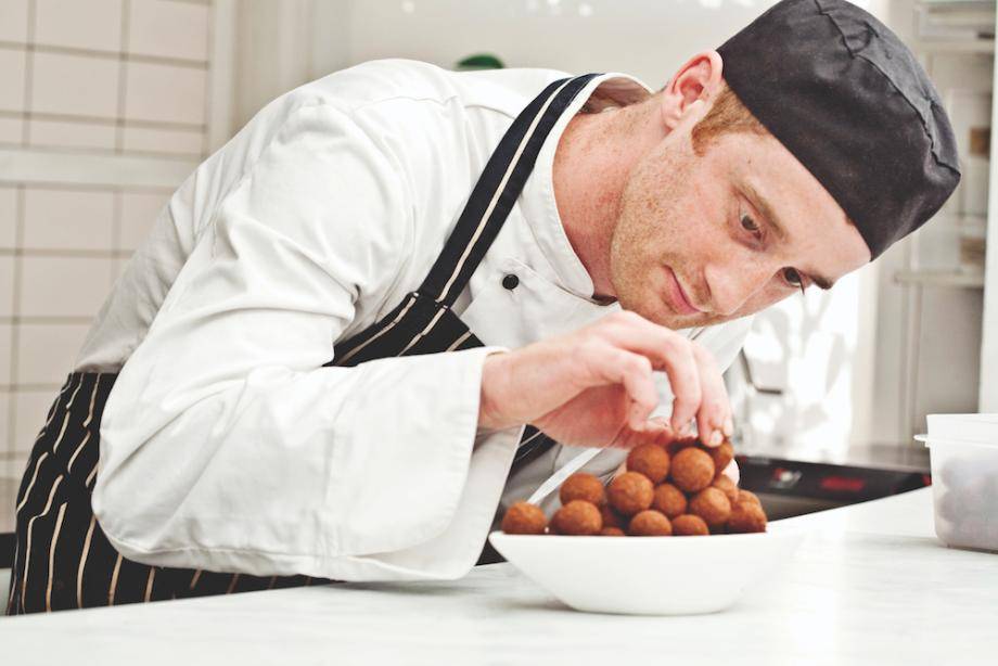 Chocolatier creating pralines