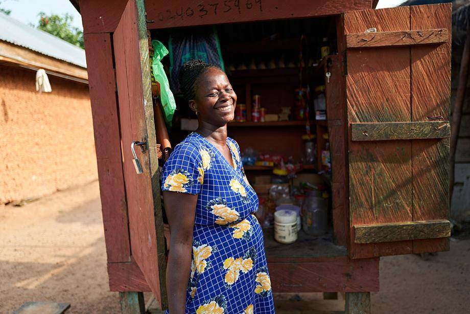 Esther in front of her market stall