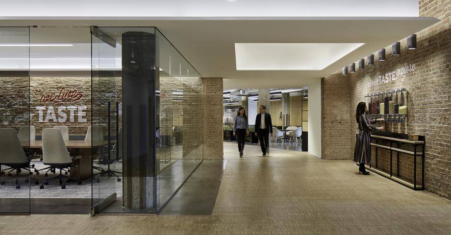 Barry Callebaut's new Chicago office, including a glass-wall conference room on the left and a chocolate wall on the right