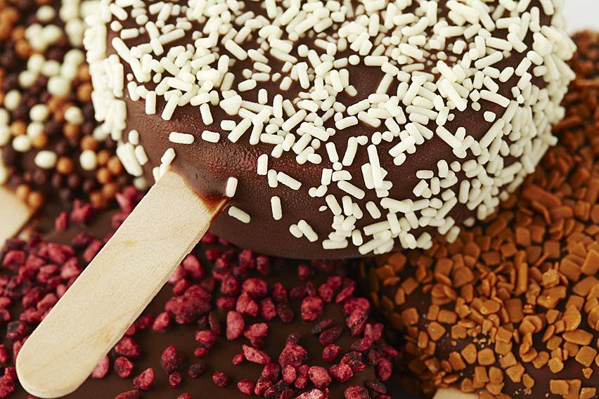 White chocolate vermicelli on a dark chocolate ice pop