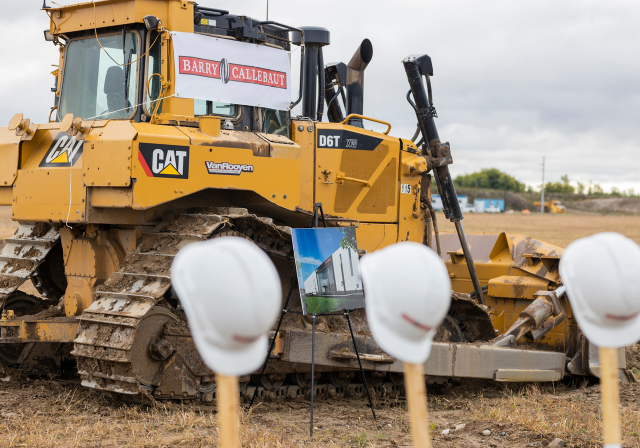 shovels in front of construction vehicle