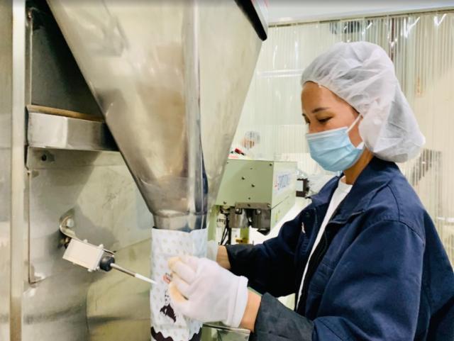 Woman working in the Suzhou chocolate factory in China